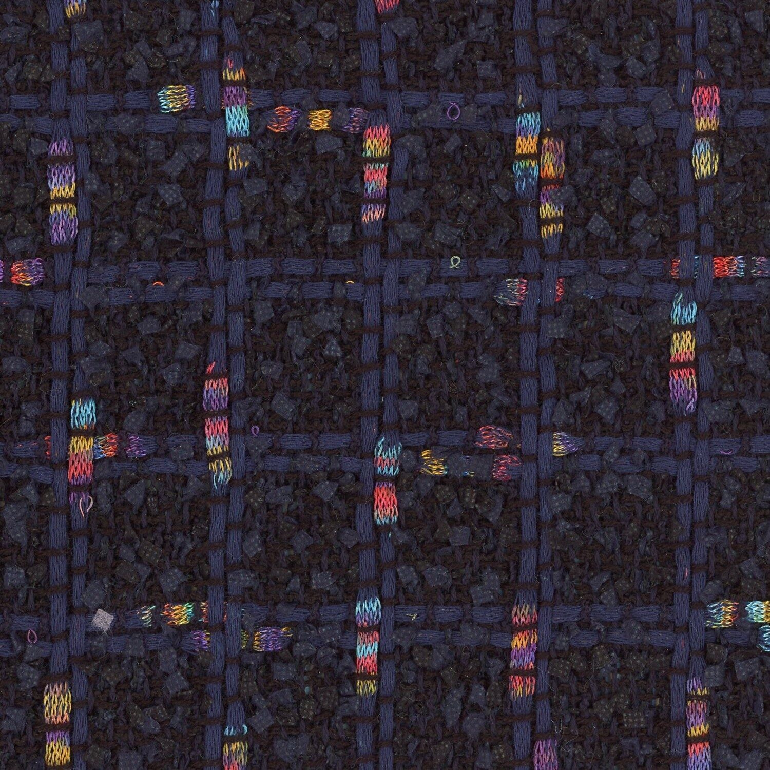 Dark navy and black cotton based tweed with a small check that has intersecting multi-coloured yarn.